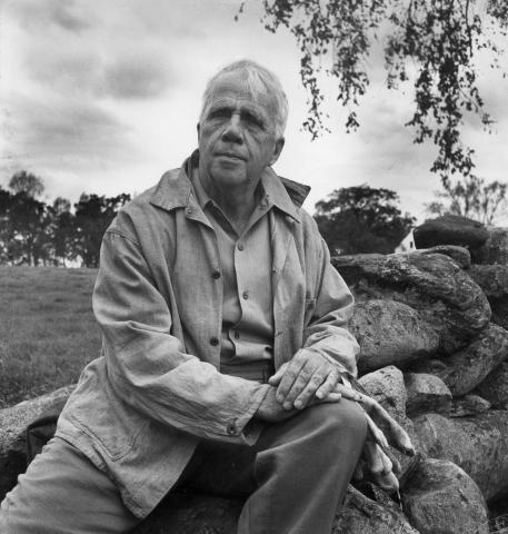 Robert Frost on stone wall ca 1960