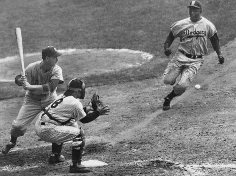 Jackie Robinson stealing home in the 1956 World Series