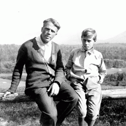 Robert Frost on rail fence with son