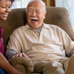 old asian man african american nurse seated laughing